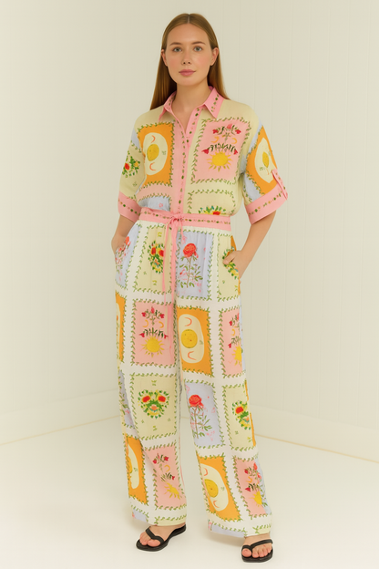 Conjunto elegante de pantalón con estampado floral y blusa de manga larga